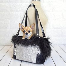Luxury leather pet travel tote encrusted with premium crystals, featuring a reinforced base for small dog safety